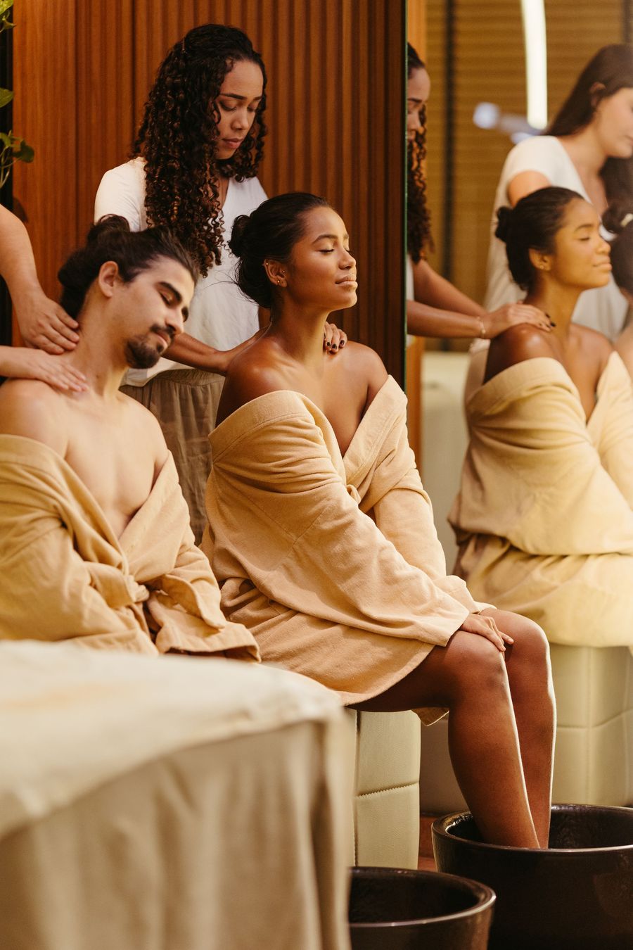 Couple with foot baths and shoulder massages